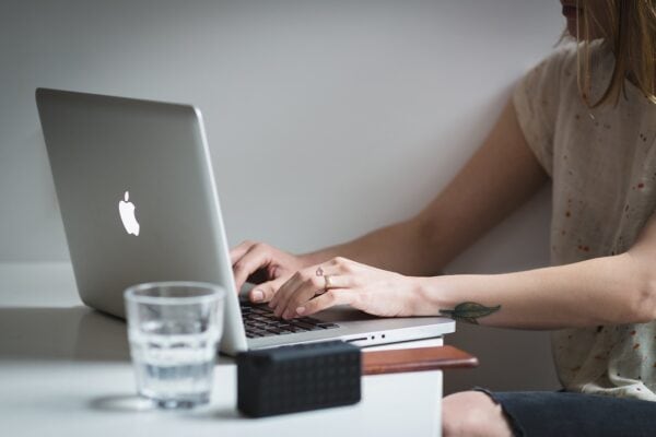 person typing on a laptop