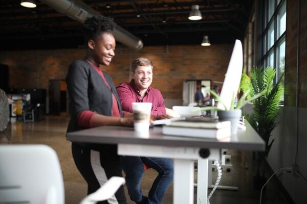 two people at a standing desk