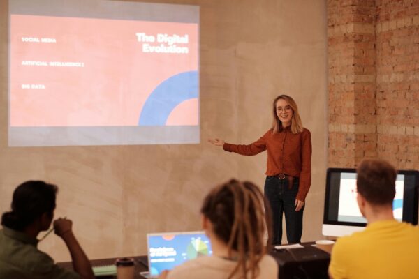 woman presenting at a conference