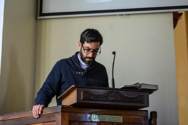 man speaking at a podium