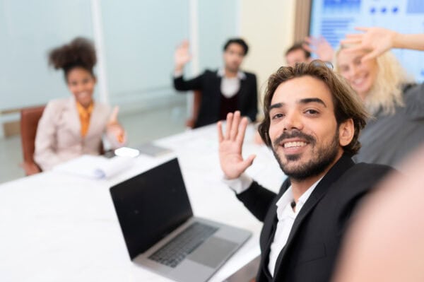 A diverse group of young business people taking selfies In the conference room