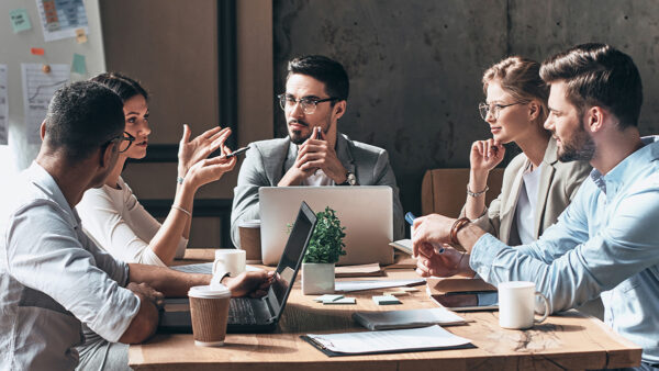 A group of business people sitting around a table