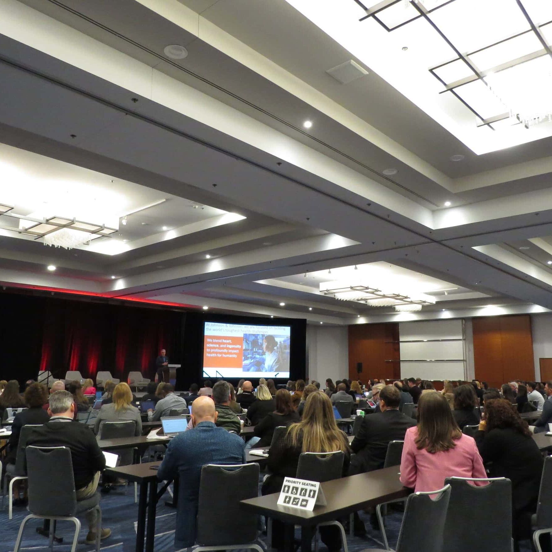 2024 LEC General Session-1 Attendees at the 2025 SIOP Leading Edge Consortium, listening to a speaker who is on the stage showing a powerpoint