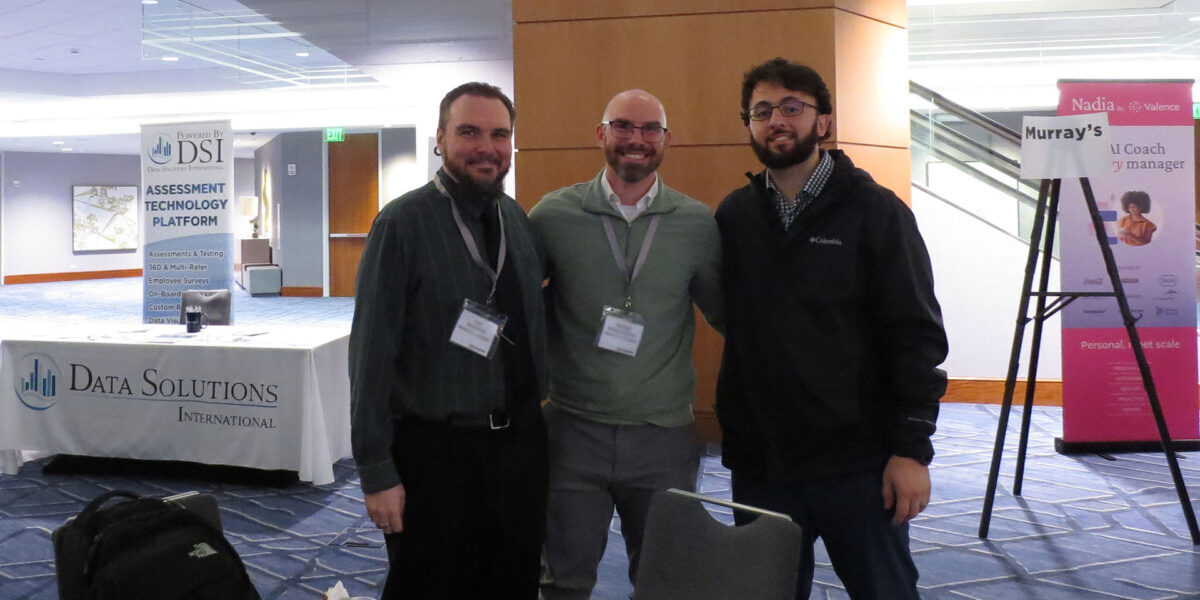 2024-lec-three-men-smiling-posing-for-photo