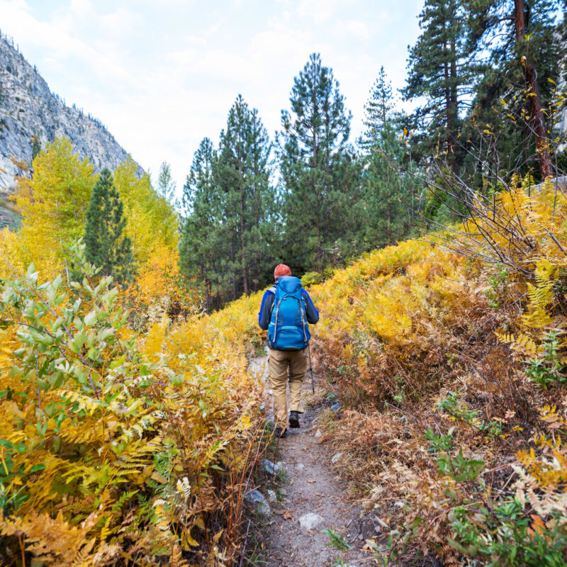 Hike in the autumn mountains. Fall season theme.