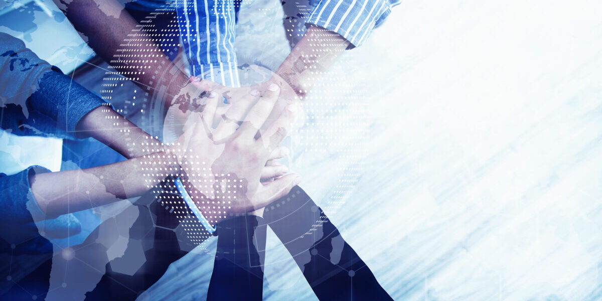 Teamwork concept. Business peoples putting their hands together in top view. Stack of hands for unity and team. Success business.