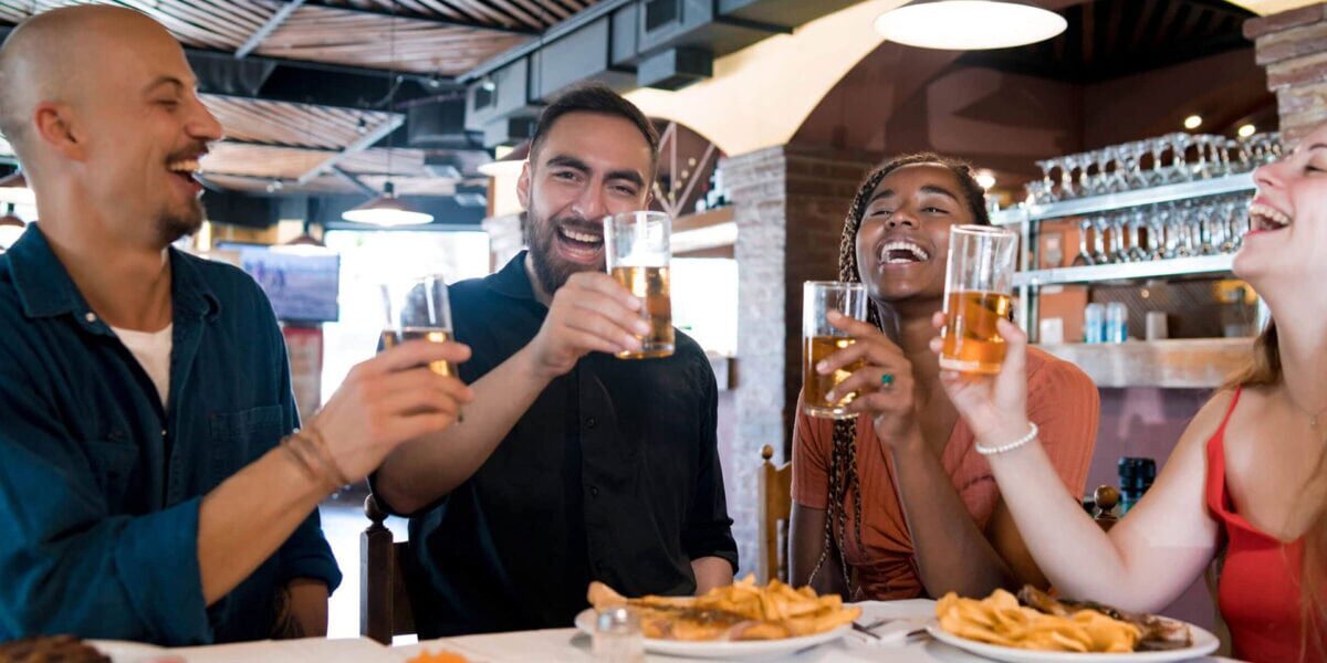 Group of friends enjoying a meal together at a restaurant.