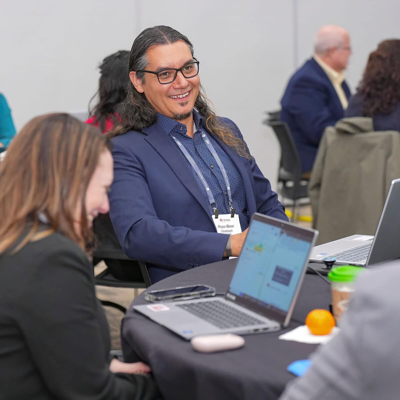 Attendees at I/O Psychology conference engaging in professional networking.
