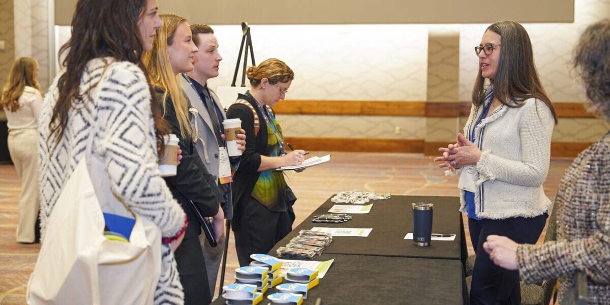 Group of professionals engaging at a career services event.