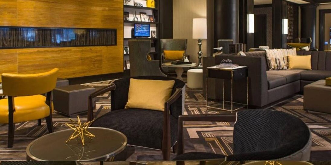 Modern conference lounge with comfortable seating and warm lighting at SIOP event.