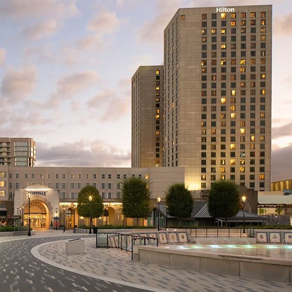 A large building with a fountain in front of it.