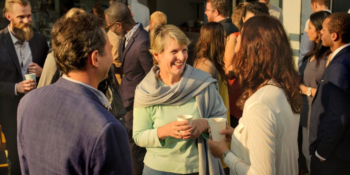 A group of professionals standing and mingling